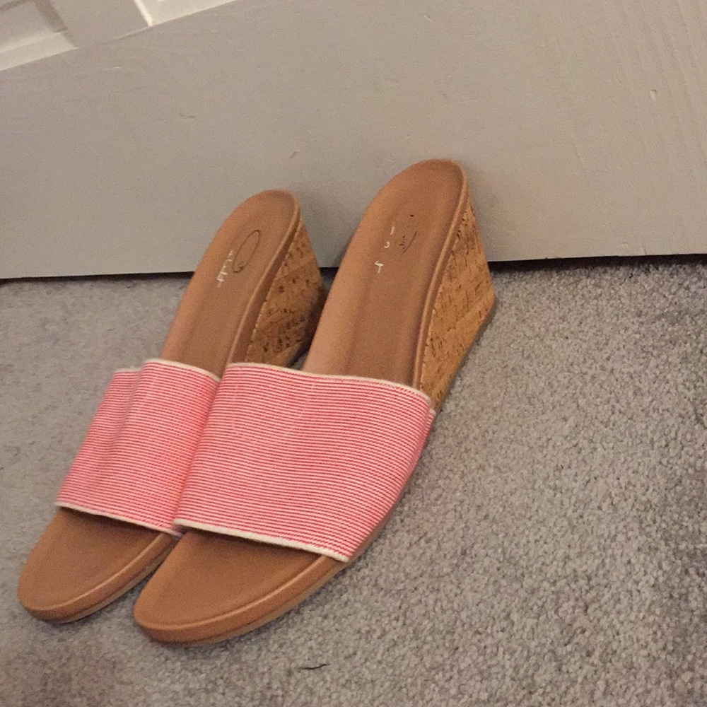 Pink and brown slide saddles with a 3 inch heel.